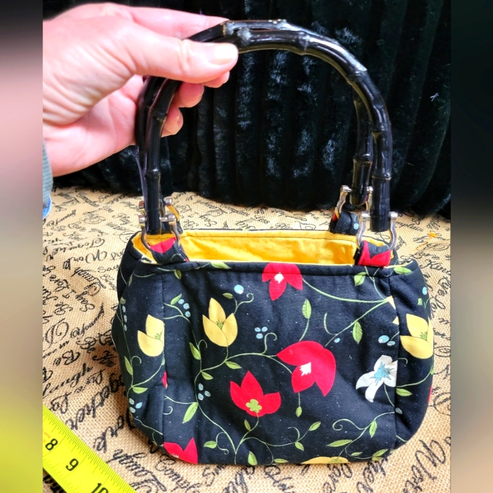 Vintage floral handbag with black bamboo handles yellow interior